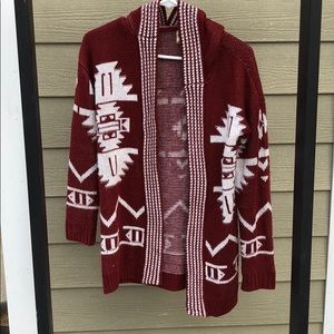 maroon sweater cardigan with white design
